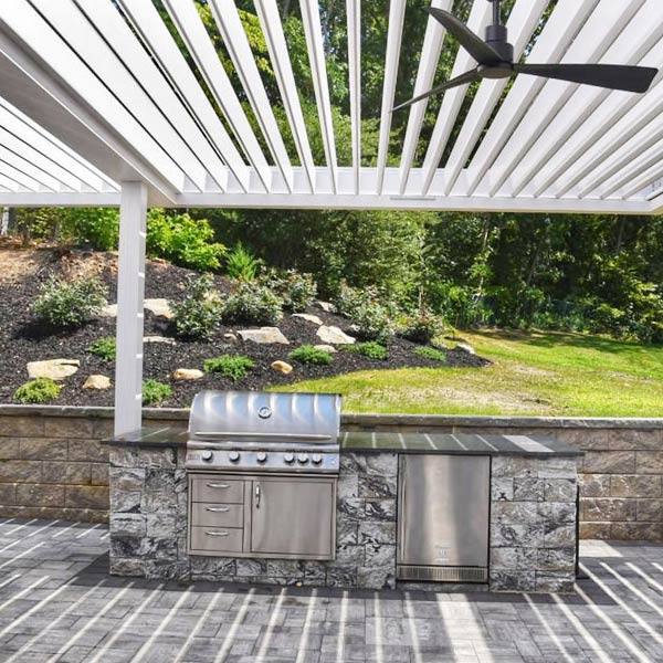 Outdoor cooking station covered with automated louvered pergola - Residential installaion in Melville. NY - Azenco